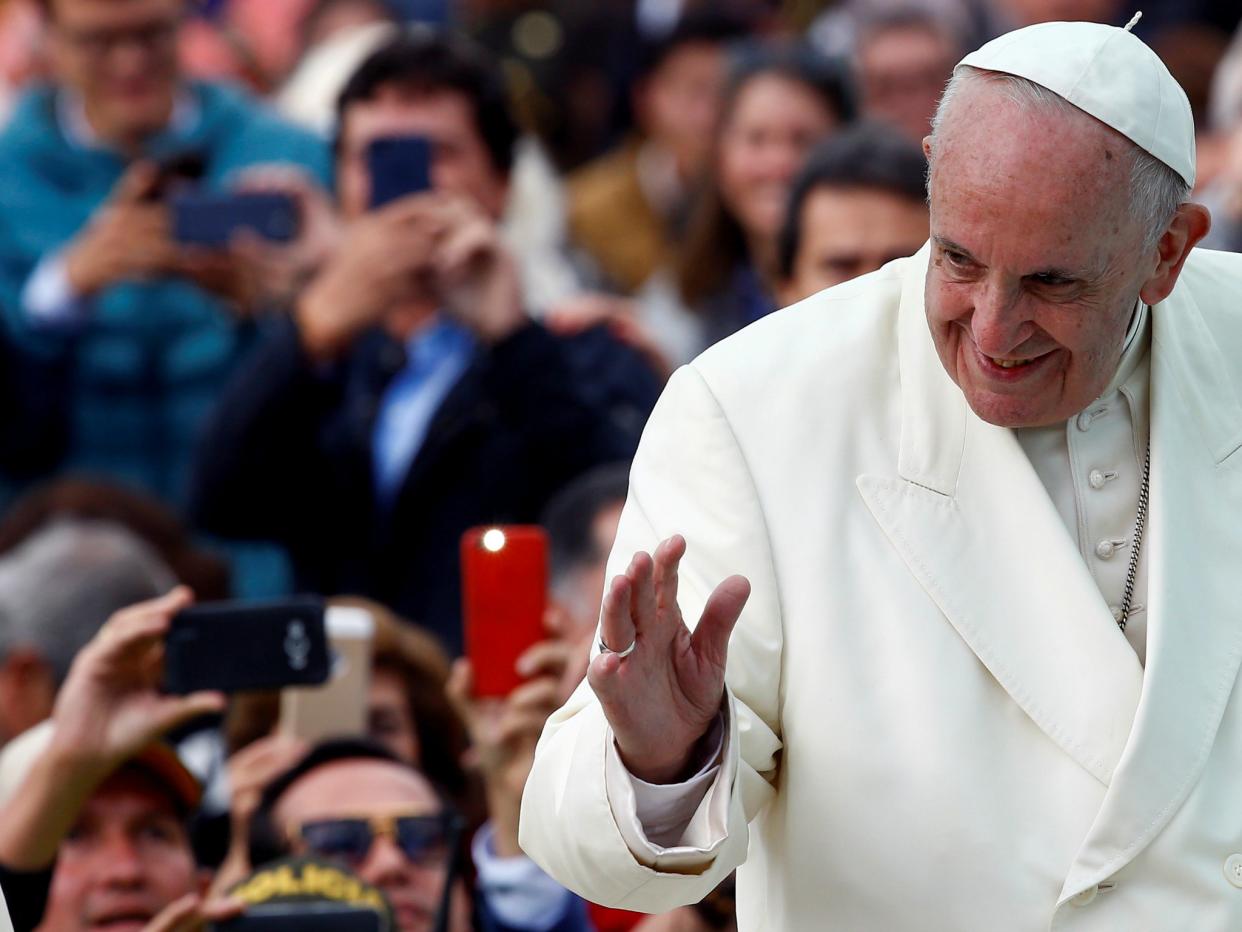 Pope Francis waves to the crowd while arriving for a holy mass at Simon Bolivar park in Bogota, Colombia: Reuters