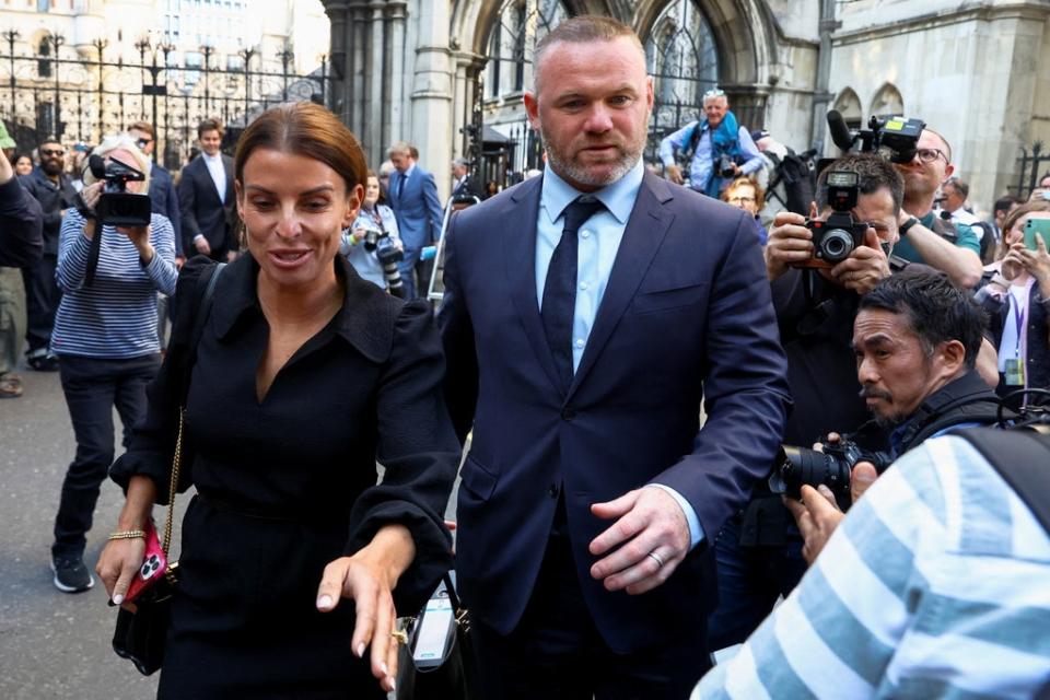 Coleen and Wayne Rooney leave the Royal Courts of Justice (Reuters)