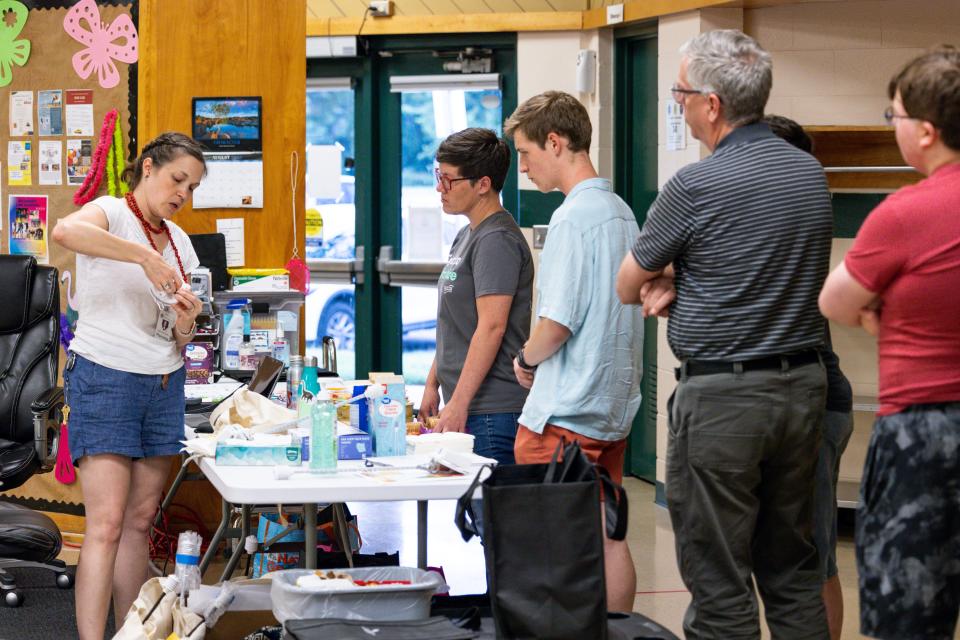 Sarah Terry-Cobo, associate planner with the Office of Sustainability for Oklahoma City, works with volunteers Saturday as they undertake an "urban heat island" mapping event to track the city's hottest areas.