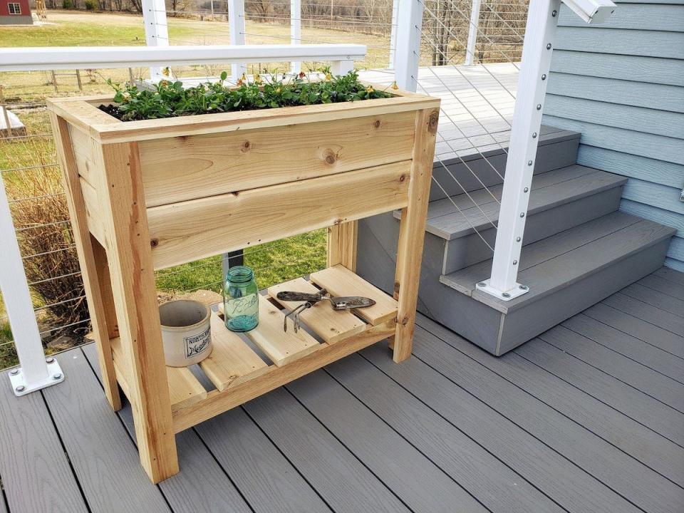 Overall Makerworks wood planter box with shelf underneath.