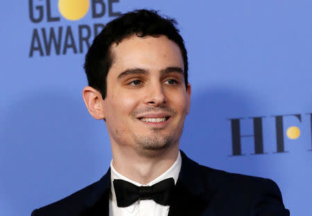 FILE PHOTO: Director Damien Chazelle after winning Best Screenplay - Motion Picture for "La La Land" during the 74th Annual Golden Globe Awards in Beverly Hills, California, U.S., January 8, 2017. REUTERS/Mario Anzuoni/ File Photo