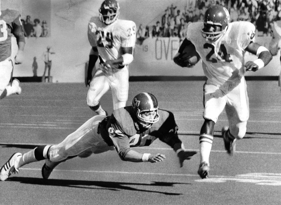   "OU's Joe Washington sets sail on his early 57-yard punt return which set up the first Sooner touchdown."Staff photo by Cliff Traverse taken 12/1/73; photo ran in the 12/2/73 Daily Oklahoman.    University of Oklahoma Sooners defeated the Oklahoma State Cowboys, 45-18, in Stillwater.File:  Football/OU/OU-OSU/Joe Washington/1973
