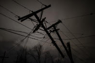 Damaged utility poles and lines hang above Underwood St. on March 3, 2020 in Nashville, Tennessee. A tornado passed through Nashville just after midnight leaving a wake of damage in its path including two people killed in East Nashville. (Brett Carlsen/Getty Images)