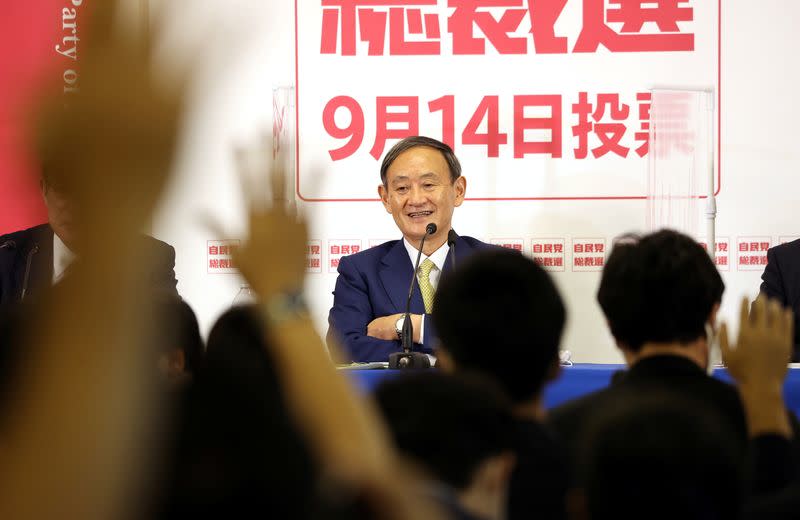 Japanese Chief Cabinet Secretary Yoshihide Suga , former Foreign Minister Fumio Kishida and former Defence Minister Shigeru Ishiba attend a speech session for the LDP leadership election in Tokyo