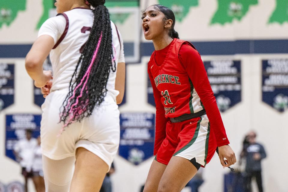 Lawrence North High School senior Kamara Mills (11) reacts after scoring during the second half of an IHSAA Class 4A Sectional semi-final basketball game against Lawrence Central High School, Friday, Feb. 2, 2024, at Cathedral High School. Lawrence Central won, 61-54.