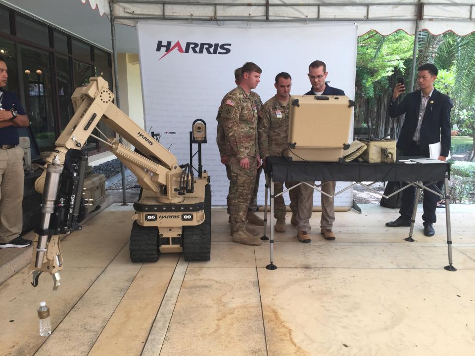 Harris officials demonstrate an explosives disposal system