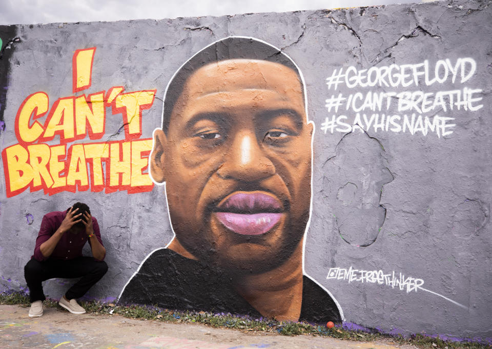 On May 29, 2020 in Berlin, Germany, citizens, came to Mauer Park, to inspect and to take photos in front of the mural of George Floyd, who died in police custody in Minneapolis, MN on Monday night. The mural drawn by Dominican graffiti artist Jesus Cruz Artiles, also known with his nickname as EME Freethinker. (Abdulhamid Hosbas/Anadolu Agency via Getty Images)