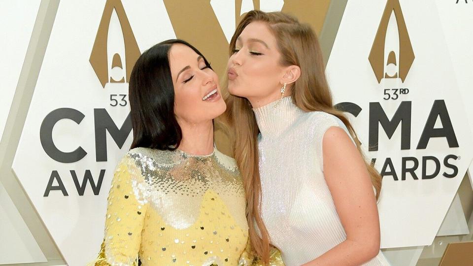 The musician and model are friendship goals on the CMA Awards red carpet.