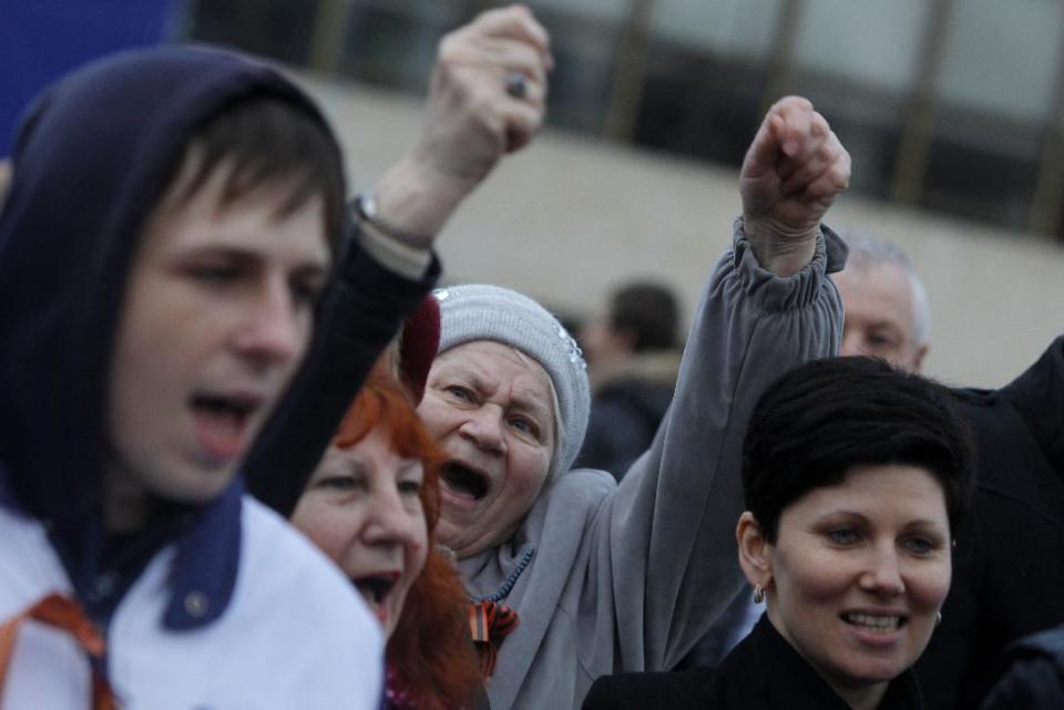 In this photo taken Wednesday, March 5, 2014, pro-Russian supporters chant slogans during a rally at a central square in Simferopol, Ukraine. Ukraine is facing a potentially crippling geographic and cultural divide, a growing gulf between supporters of Russia who dominate the east and south of the country, and western Ukrainians who yearn for closer ties to Western Europe. One side of that divide is even starker in Crimea, a Black Sea peninsula. For much of the past 200 years, Crimea was under Russian and Soviet control, and today most Crimeans see themselves as only nominally Ukrainian and Russian is, by far, the dominant language (AP Photo/Sergei Grits)