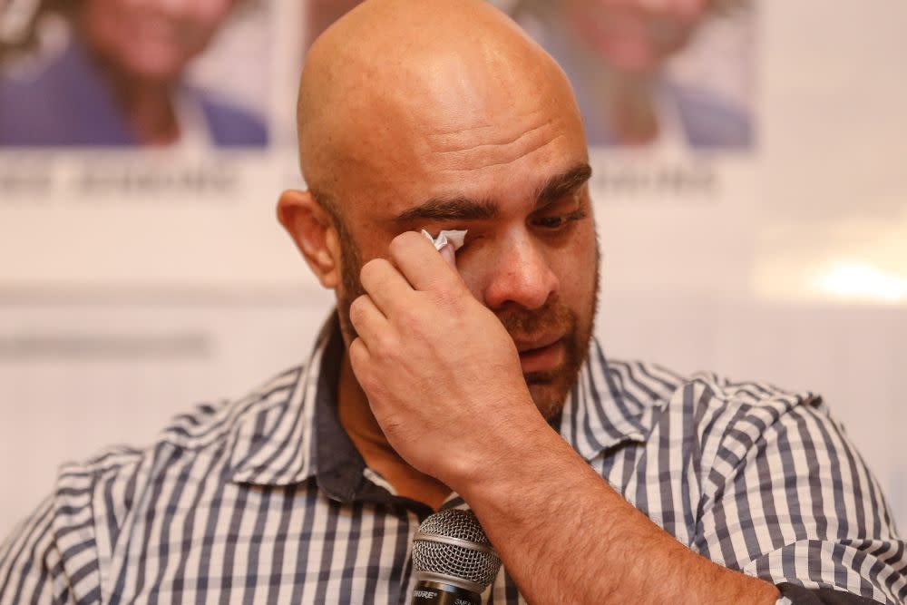 Greg Jenkins, son of missing Australian woman Annapuranee Jenkins, wipes away tears as he speaks during a press conference in George Town August 14, 2020. — Picture by Sayuti Zainudin