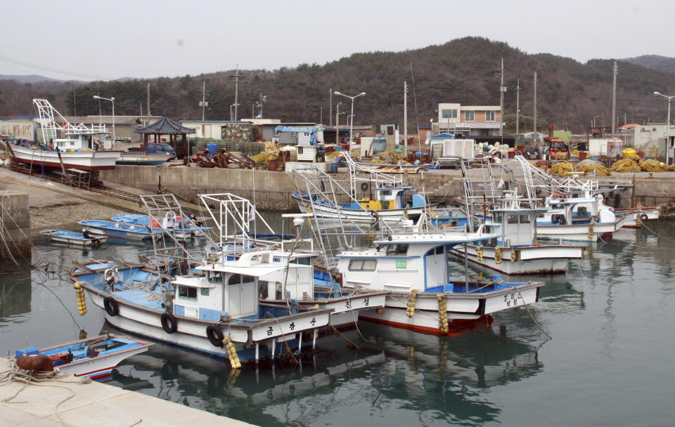 South Korean fishing boats gather at a port on Baengnyeong Island, South Korea, Monday, March 31, 2014. South Korea on Monday returned fire into North Korean waters after shells from a North Korean live-fire drill fell south of the rivals' disputed western sea boundary, a South Korean military official said. Residents on a front-line South Korean island said they were evacuated to shelters during the exchange. (AP Photo/Yonhap) KOREA OUT