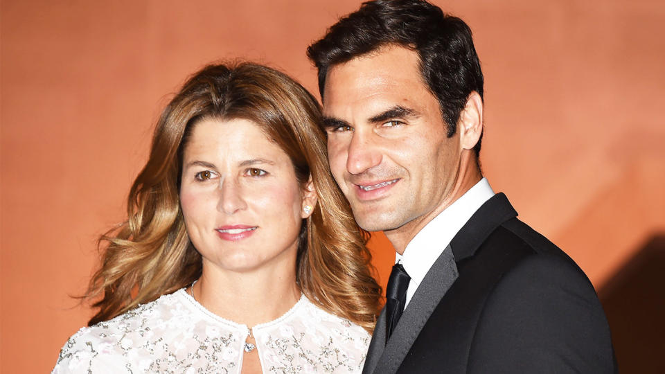 Roger and Mirka Federer take photos as they arrive at the Wimbledon Champions Dinner 2017.