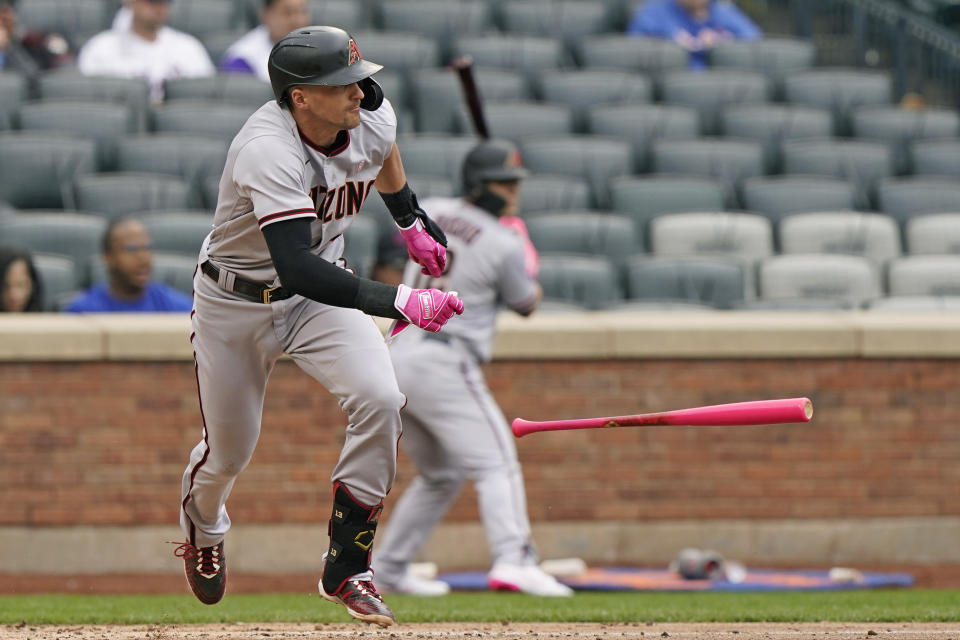 Arizona Diamondbacks' Nick Ahmed drops the bat after hitting into an RBI-groundout during the fifth inning of a baseball game against the New York Mets, Sunday, May 9, 2021, in New York. (AP Photo/Kathy Willens)