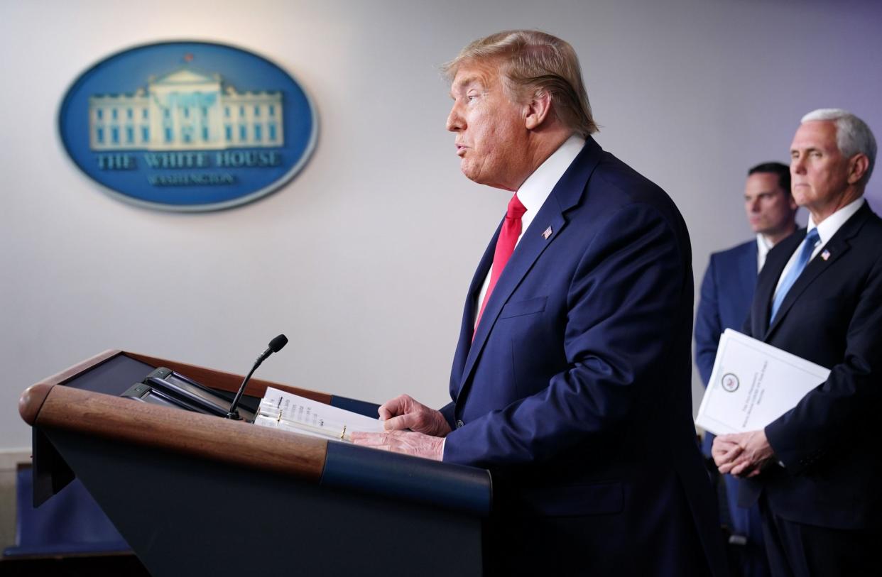 Donald Trump speaks at a White House briefing on the coronavirus pandemic: AFP via Getty Images