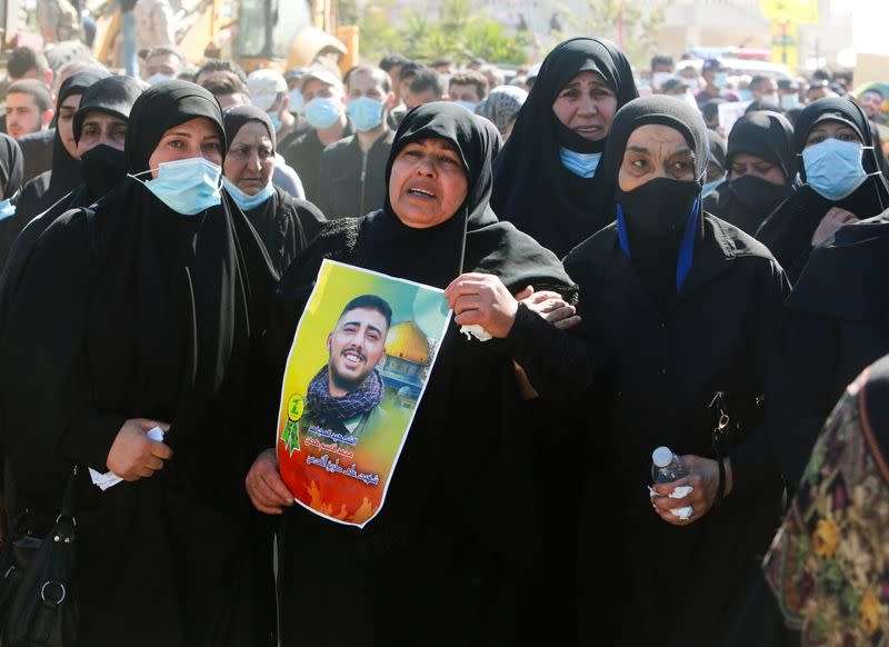 Mother of Mohamed Tahan, who was killed at the border fence with Israel yesterday, reacts during his funeral, in Adloun