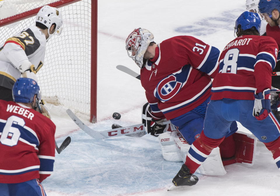 Montreal Canadiens goaltender Carey Price is scored against by Vegas Golden Knights' Paul Stastny (not shown) as Canadiens' Shea Weber (6) and Ben Chiarot (8) and Knights' Max Pacioretty look for the rebound during second-period NHL hockey game action in Montreal, Saturday, Jan. 18, 2020. (Graham Hughes/The Canadian Press via AP)