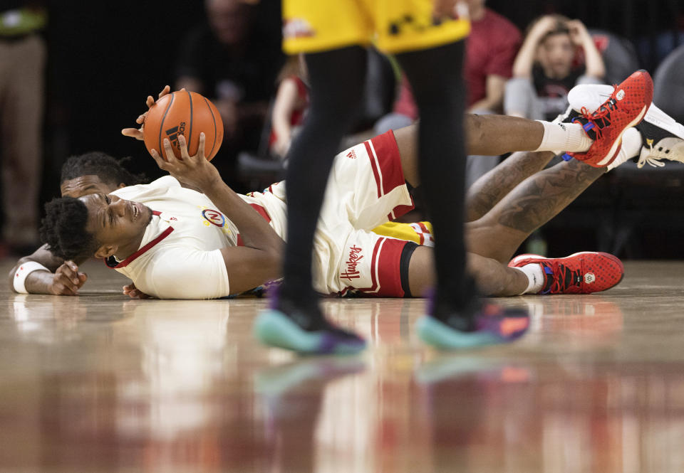 Nebraska's Blaise Keita, front, grabs the ball against Maryland's Julian Reese, back, during the first half of an NCAA college basketball game Sunday, Feb. 19, 2023, in Lincoln, Neb. (AP Photo/Rebecca S. Gratz)