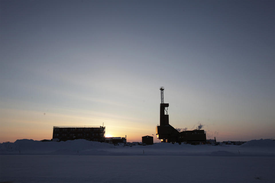 The sun sets behind an oil drilling rig in Prudhoe Bay, Alaska on March 17, 2011. / Credit: Lucas Jackson / REUTERS