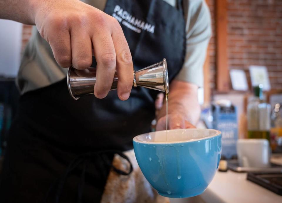 Cruz Conrad of Pachamama Café Orgánico demonstrates the making of olive oil lattes on Tuesday.