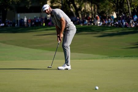 Mar 23, 2019; Palm Harbor, FL, USA; Dustin Johnson putts on the 14th green during the third round of the Valspar Championship golf tournament at Innisbrook Resort - Copperhead Course. Mandatory Credit: Jasen Vinlove-USA TODAY Sports