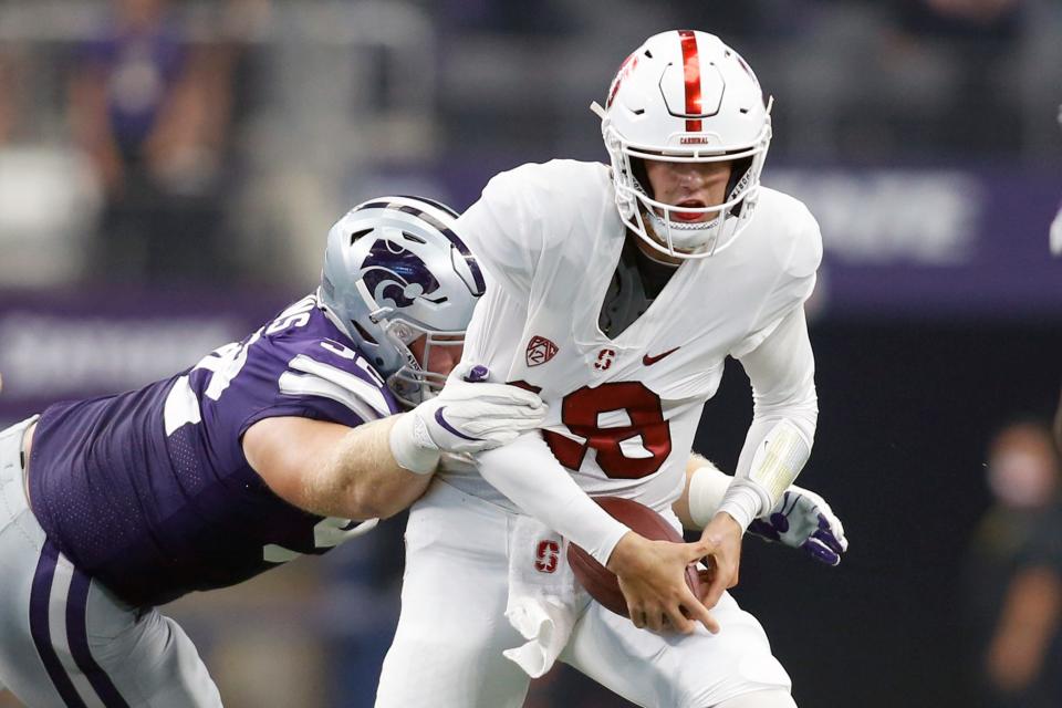 Kansas State defensive tackle Eli Huggins (92) sacks Stanford quarterback Tanner McKee (18) in last year's season opener.