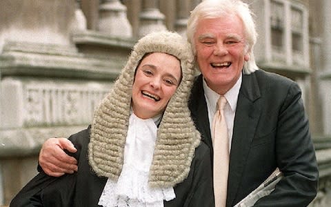  Cherie Booth, the wife of Tony Blair, celebrating with her father Tony Booth outside the High Court after she was sworn in as a QC - Credit: Fiona Hanson/PA