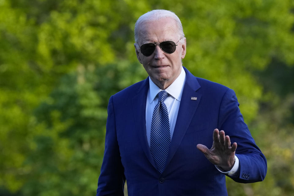 President Joe Biden waves as he walks across the South Lawn of the White House in Washington, Tuesday, April 23, 2024, after returning from a trip to Florida where he blamed Donald Trump for Florida's upcoming abortion ban. (AP Photo/Susan Walsh)