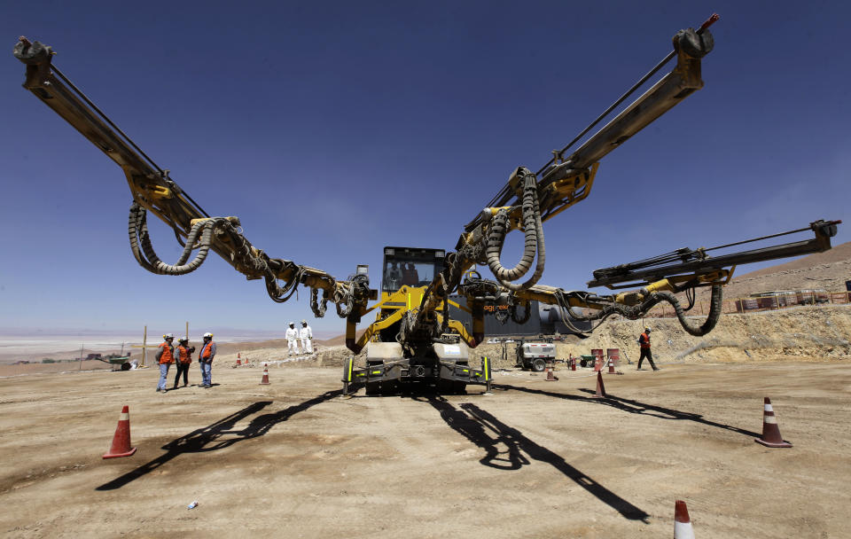 In this Sept. 25, 2012 photo, a multiple perforation machine used to place explosives into rock walls stands at the Chuquicamata copper mine in the Atacama desert in northern Chile. Experts say that by 2019 the Chuquicamata copper mine will be unprofitable, so state-owned mining company Codelco is trying to head off closure by converting the open pit into the world's largest underground mine. Codelco believes the mine still has much more to give, with reserves equal to about 60 percent of all the copper exploited in the mine's history still buried deep beneath the crater. (AP Photo/Jorge Saenz)