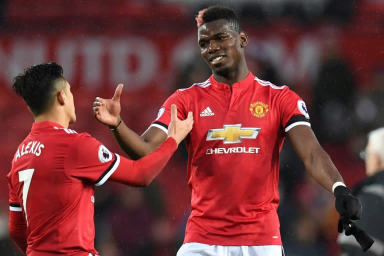 An unspecified illness saw Paul Pogba (R) withdraw on the morning of Manchester United's match in Huddersfield