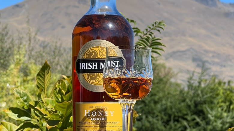 Irish Mist bottle with glass