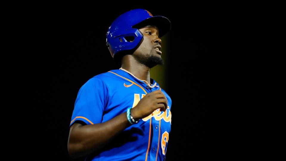 Mar 7, 2023;  West Palm Beach, Florida, USA;  New York Mets shortstop Ronny Mauricio (60) attempts to get to third base against the Houston Astros during the seventh inning at The Ballpark of the Palm Beaches.