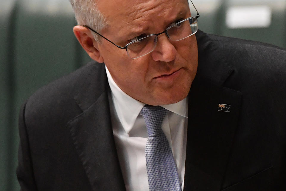 CANBERRA, AUSTRALIA - MARCH 24: Prime Minister Scott Morrison during Question Time in the House of Representatives at Parliament House on March 24, 2021 in Canberra, Australia. On Monday, the federal government was set back by new allegations broadcast by the Ten Network after pixelated images of unnamed Coalition advisers allegedly engaging in performing lewd sex acts on the desks of female MPs resulting in a Morrison staff member being sacked last night. Additionally, the ABC Network aired a first hand account by an Australian Parliament security guard of what she witnessed on the night Brittany Higgins was allegedly raped in the office of then-defence industry minister Linda Reynolds in early 2019. (Photo by Sam Mooy/Getty Images)