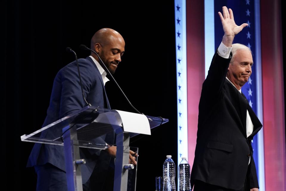 Republican U.S. Senate candidate Ron Johnson, right, and Democratic U.S. Senate candidate Mandela Barnes, left, are introduced during a televised debate Thursday, Oct. 13, 2022, in Milwaukee. (AP Photo/Morry Gash)