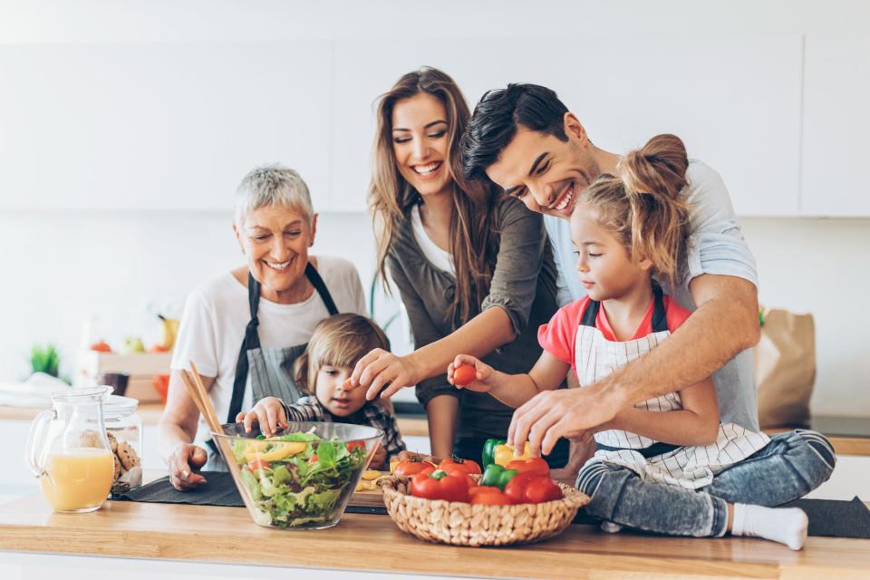 A family cooks at home.