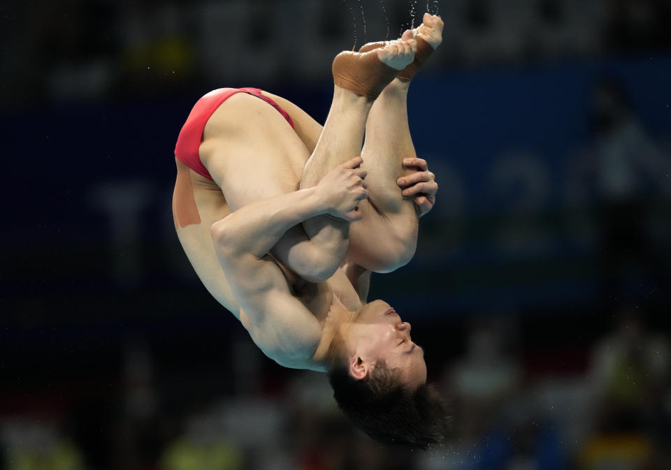 Xie Siyi of China competes in men's diving 3m springboard final at the Tokyo Aquatics Centre at the 2020 Summer Olympics, Tuesday, Aug. 3, 2021, in Tokyo, Japan. (AP Photo/Dmitri Lovetsky)