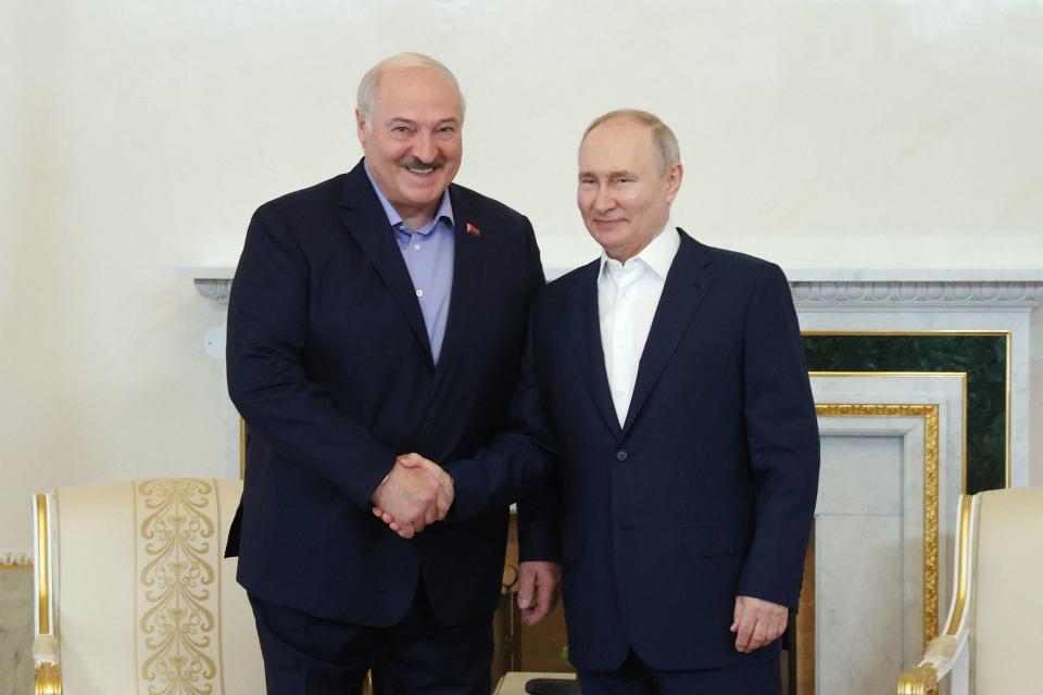 Russia's President Vladimir Putin (R) and Belarus' President Alexander Lukashenko (L) pose for photographs prior to their meeting at the Constantine (Konstantinovsky) Palace in Strelna, outside Saint Petersburg, on July 23, 2023. Russian President Vladimir Putin has met his closest ally, Belarusian President Alexander Lukashenko, for the first time since the latter helped broker a deal to end a mutiny by Wagner fighters inside Russia last month. (Photo by Alexandr Demyanchuk / SPUTNIK / AFP) (Photo by ALEXANDR DEMYANCHUK/SPUTNIK/AFP via Getty Images)