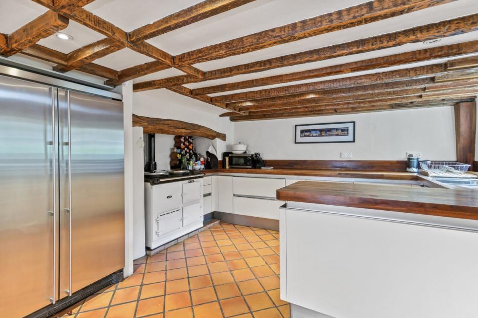 The Happy Place host's former kitchen comes with an Aga (John D Wood & Co/handout)