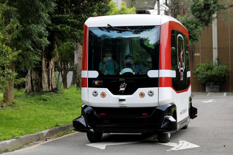 FILE PHOTO: French-made 'EZ10' autonomous bus, also known as a driverless vehicle, runs at university campus in Taipei