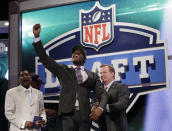 Georgia Tech wide reciever Stephen Hill celebrates as NFL Commissioner Roger Goodell, right, and Wesley Welker, left, watch after Hill was selected 43rd overall by the New York Jets in the second round of the NFL football draft at Radio City Music Hall, Friday, April 27, 2012, in New York. (AP Photo/Frank Franklin II)