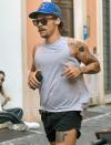 <p>Harry Styles jogs through Rome, Italy on Saturday, sporting a growing mustache. </p>