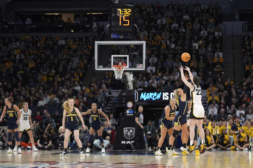 Iowa guard Caitlin Clark (22) shoots during the first half of an NCAA college basketball game against Michigan in the semifinals of the Big Ten women's tournament Saturday, March 9, 2024, in Minneapolis. (AP Photo/Abbie Parr)