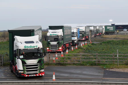 Lorries leave disused Manston Airport to attend a test drive to the Port of Dover during a trial of how road will cope in case of a "no-deal" Brexit, Kent, Britain January 7, 2019. REUTERS/Toby Melville