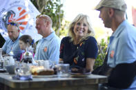 US First Lady Jill Biden meets military surfers and their families in Newlyn, Cornwall, England, on the sidelines of the G7 summit, Saturday June 12, 2021. US First Lady Jill Biden met with veterans, first responders and family members of Bude Surf Veterans, a Cornwall-based volunteer organization that provides social support and surfing excursions for veterans, first responders and their families. (Daniel Leal-Olivas/Pool via AP)