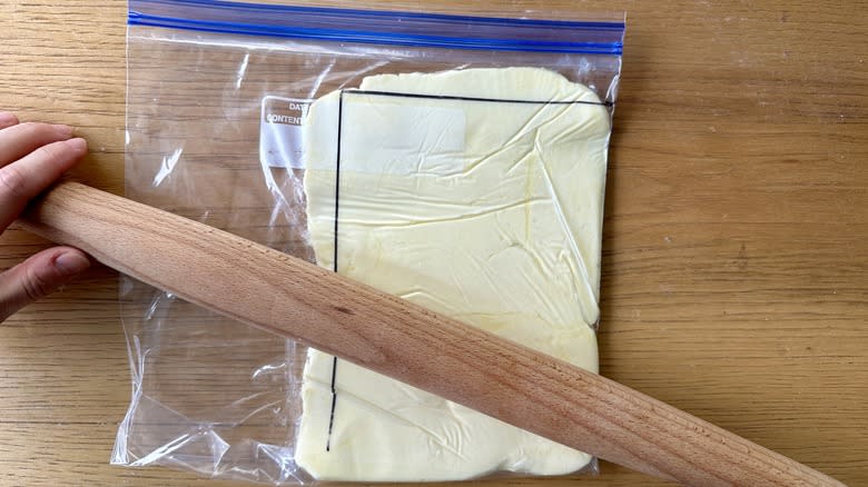 rolling butter in plastic bag