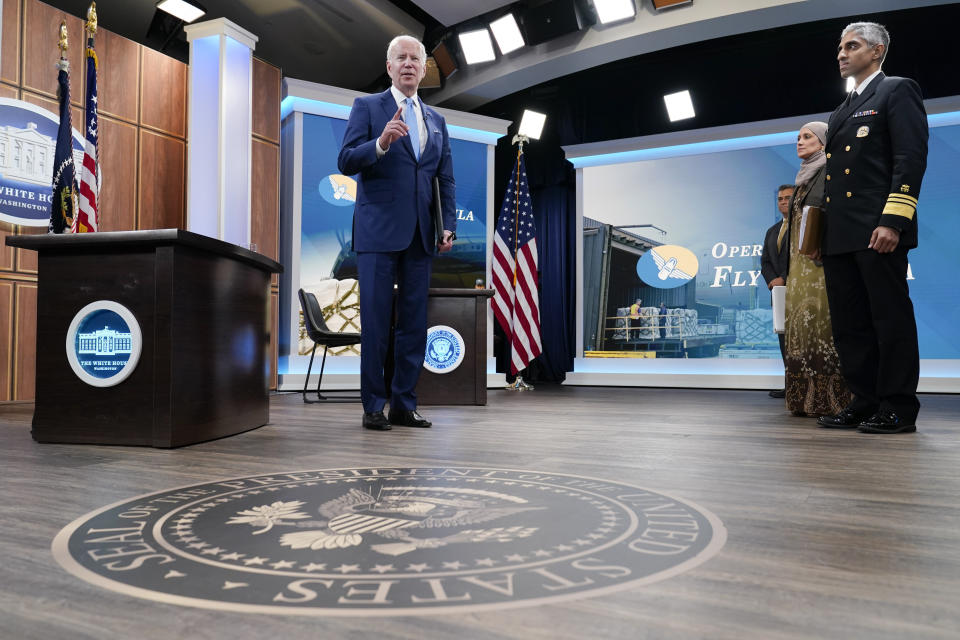 President Joe Biden responds to questions from the media after meeting with infant formula manufacturers virtually from the South Court Auditorium on the White House complex in Washington, Wednesday, June 1, 2022. Surgeon General Vivek Murthy is at right. (AP Photo/Susan Walsh)