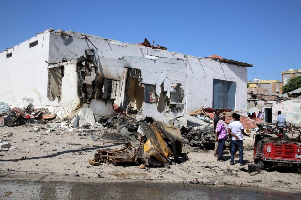 A view of damage at the scene after an al-Shabab suicide car blast targeted a security convoy in Mogadishu, Somalia on Jan. 12, 2022.<span class="copyright">Sadak Mohamed—Anadolu Agency/Getty Images</span>