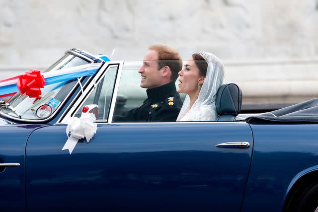 <p>Max Mumby/Indigo/Getty Images</p> Prince William and Kate Middleton leave Buckingham Palace on their April 29, 2011 wedding day.
