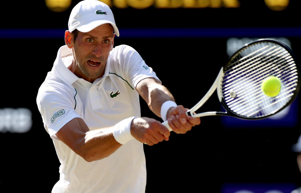 Novak Djokovic of Serbia hits a return during the men's singles semifinal match against Cameron Norrie of Great Britain at Wimbledon Tennis Championship in London, Britain, on July 8, 2022. (Photo by Li Ying/Xinhua via Getty Images)