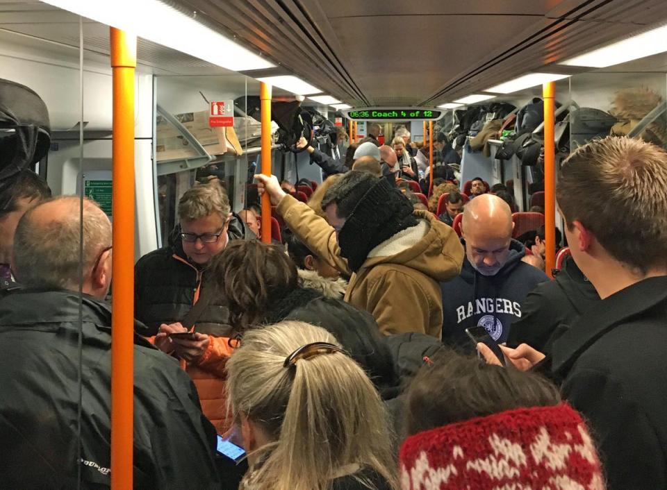 Commuters ride a crowded South Western Railway train on the Portsmouth to London Waterloo line as workers in five rail companies stage a fresh wave of strikes in the bitter disputes over the role of guards, causing disruption to services in the first full week back to work after the festive break (PA)