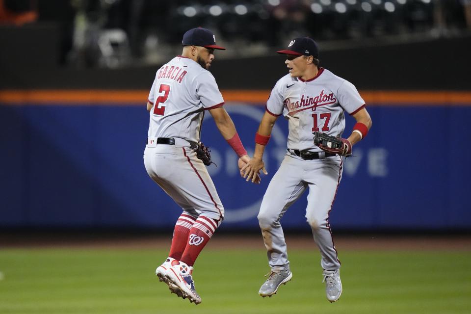 Washington Nationals' Luis Garcia (2) celebrates with Alex Call (17) after a baseball game against the New York Mets, Saturday, July 29, 2023, in New York. (AP Photo/Frank Franklin II)